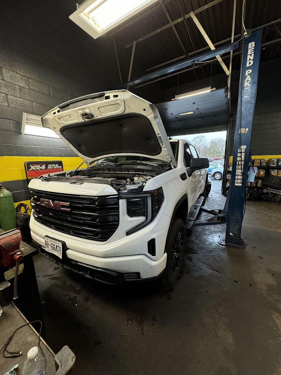A truck on the lift at MG Auto Mechanic Service